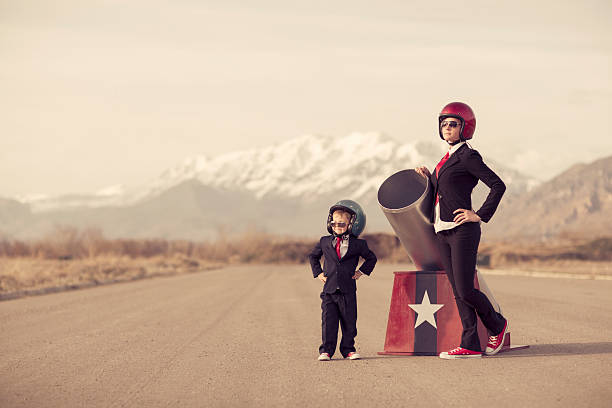 istock Team Business Suits Stand with Human Cannon 526725533