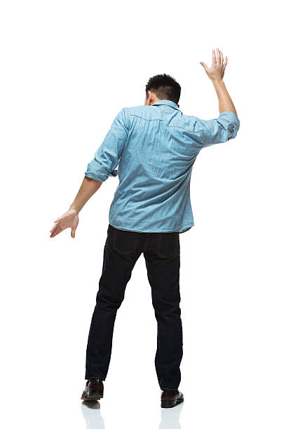 istock Rear view of man dancing 526726137