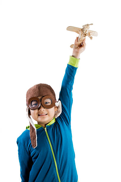 istock Asian Chinese Boy Playing with Wooden Airplane 526726148