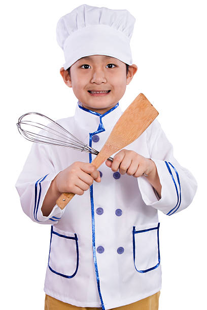 istock Asian Chinese Boy in White Chef Uniform Holding Baking Tools 526726420