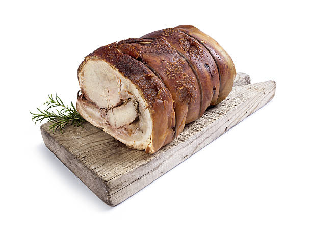 istock Pork roast on wooden cupboard with rosemary. 526727491