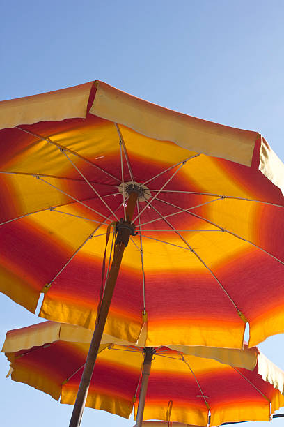 istock Red and yellow beach umbrellas on Amalfi Beach 526728061