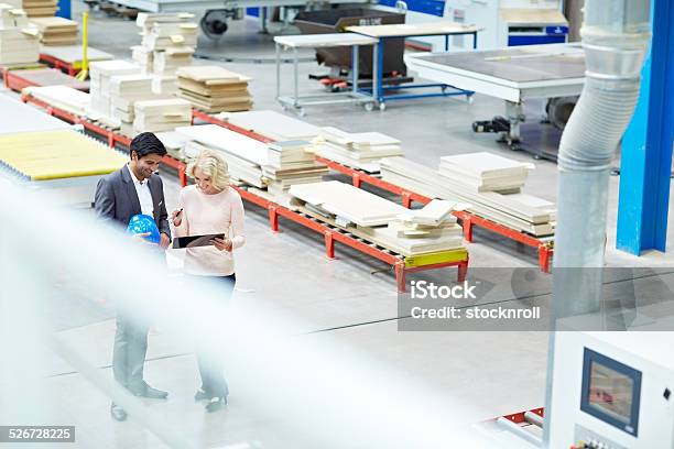 Business People At Factory Shopfloor Stock Photo - Download Image Now - Manager, 30-39 Years, Adult