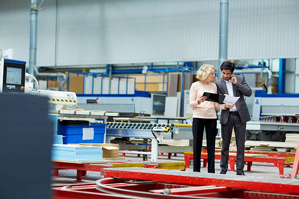 istock Senor woman showing production reports to manager 526728247