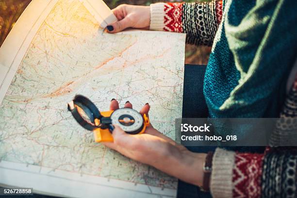 Compass On Background Of Map In The Forest Stock Photo - Download Image Now - Map, Navigational Compass, Mountain