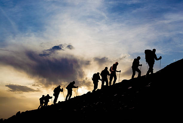 istock Silhouettes of hikers At Sunset 526729056