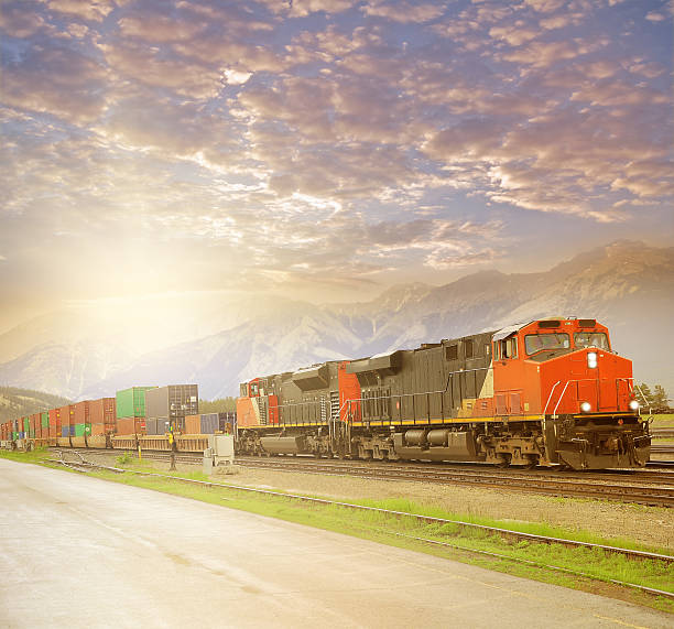 istock Freight train in Canadian rockies at sunset. 526729283
