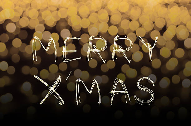 istock Merry X' Mas sparkle firework with gold bokeh 526729419