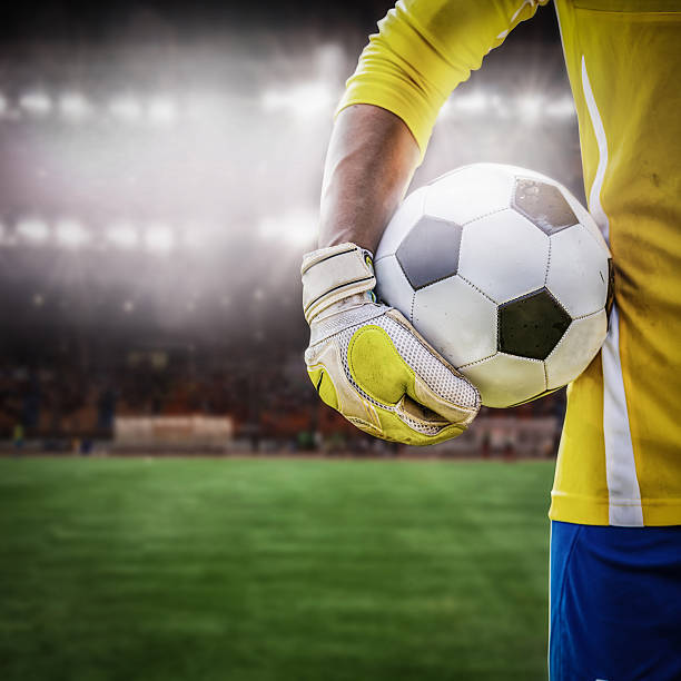 istock close up goalkeeper holding soccer ball 526730210