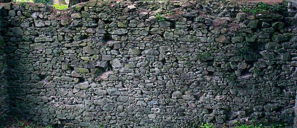 istock Stone wall texture. Old rock blocks in old medieval brick. 526731150