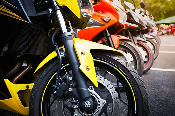 Photo of motorcycles standing in the row