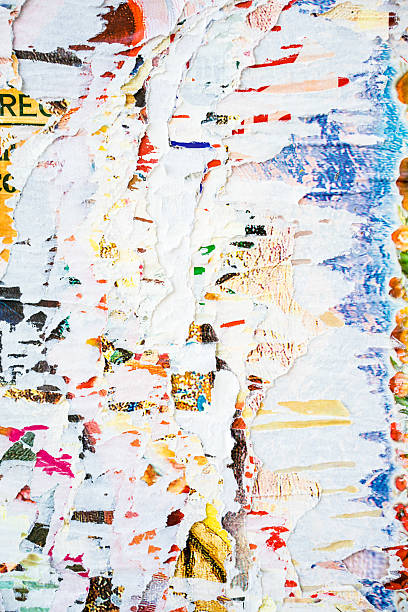 istock Close-up of torn adverts on wall 526733110
