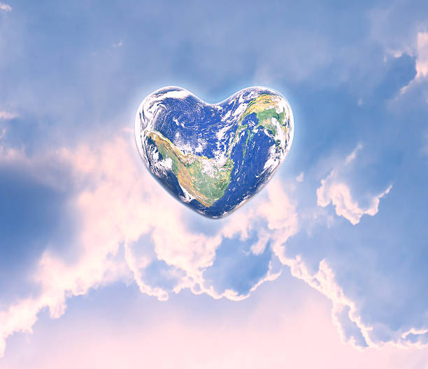 istock World in heart shape with over women human hands 526733390