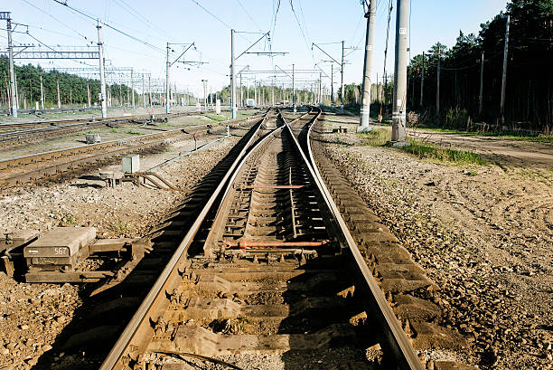 istock Railway tracks, rails and electric columns 526733546