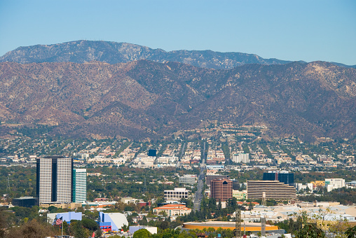 The Burbank Media District skyline in the foreground with Downtown Burbank and the Verdugo Mountains in the background.  Burbank is located in the San Fernando Valley in the Los Angeles metropolitan area.