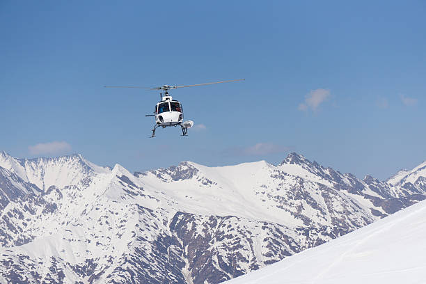 istock White rescue helicopter  in the mountains 526736122