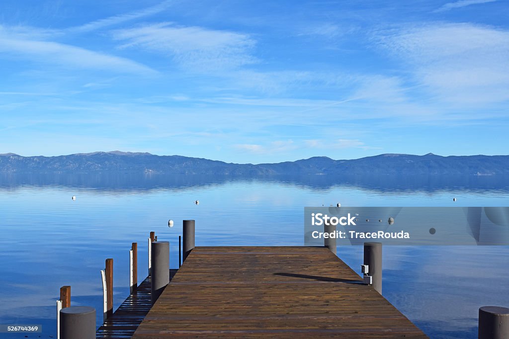 Lake Tahoe Dock A dock extends to the edge of the water in Lake Tahoe  Beach Stock Photo