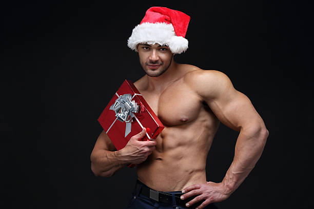 cadeau de noël - men muscular build body building sensuality photos et images de collection