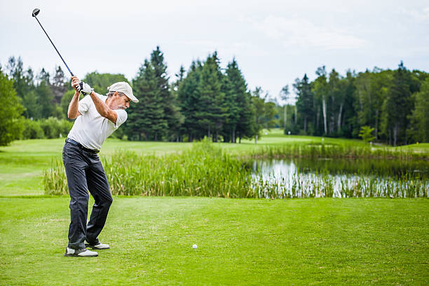 Mature Golfer on a Golf Course stock photo