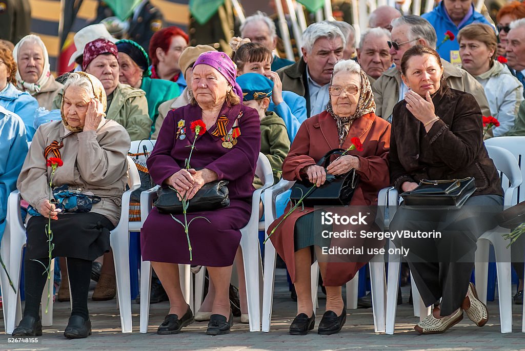 Senior female veterans of World War II on tribunes Tyumen, Russia - May 9. 2009: Victory Day in Tyumen. Senior female veterans of World War II meet on tribunes waiting for parade Adult Stock Photo