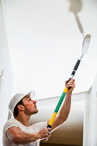 istock Closeup of Man Painting the Ceiling 526748209