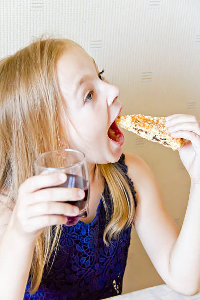 istock Eating cute girl 526749855
