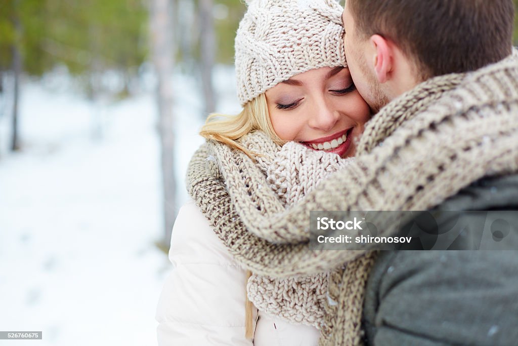Happy woman Woman embracing with her boyfriend in winter Adult Stock Photo