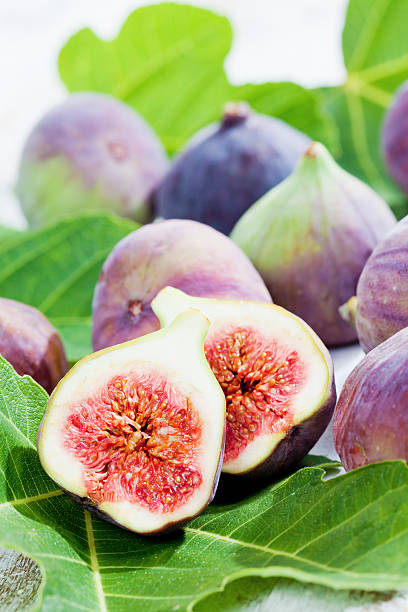 istock Fresh figs with leaves, close up 526760777