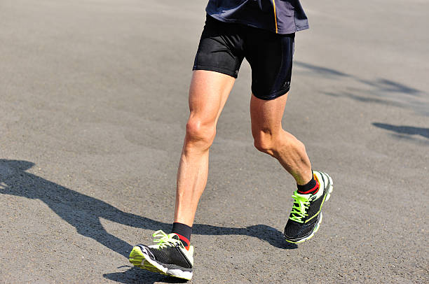 istock marathon runner athlete running on city road 526761171