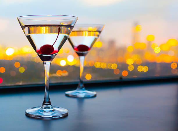 istock Cocktail glasses with city view 526762307