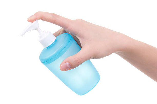 istock female hand holding bottle with liquid soap isolated on white 526763091