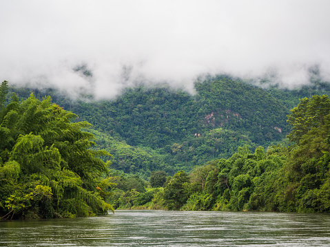 Nature landscape of river and mist over mountain, Kanchanaburi, Thailand