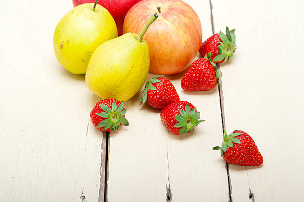 istock fresh fruits apples pears and strawberrys 526764337