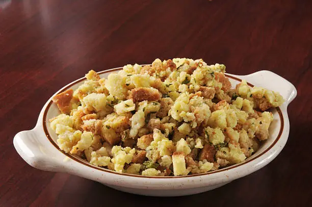 A bowl of cornbread stuffing in turkey broth