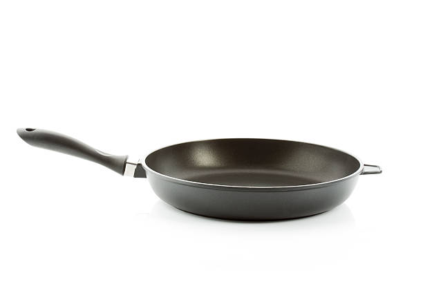istock Aluminium fry pan isolated against white background 526765251