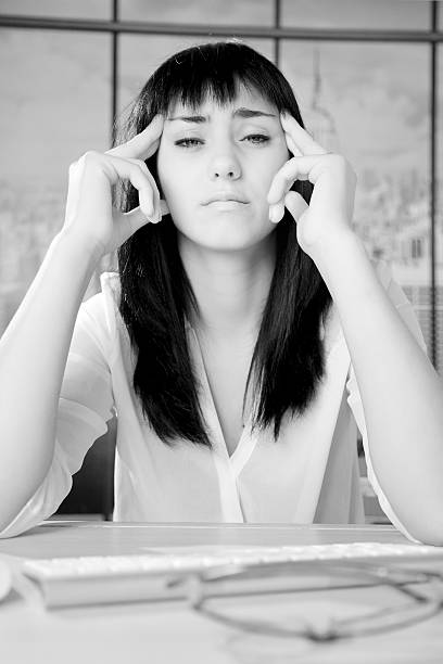 istock Business woman in office with strong headache 526784287
