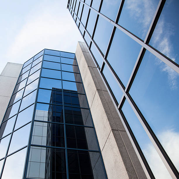 istock office building and reflections of clouds 526784431
