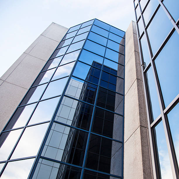 istock office building and reflections of clouds 526785037