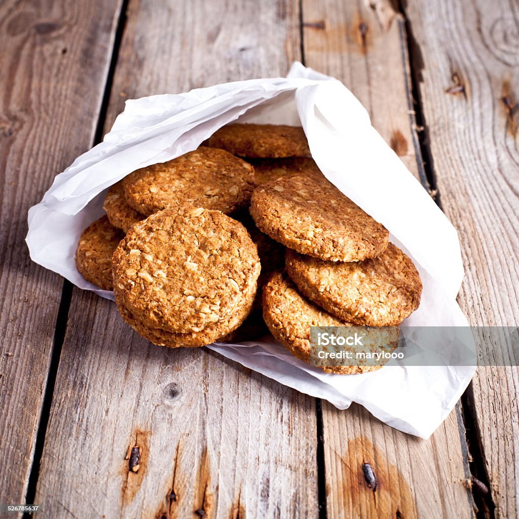 fresh crispy oat cookies fresh crispy oat cookies on rustic wooden table  Baked Stock Photo