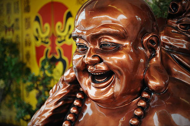 Bronze Statue of Budai or The Happy Buddha at a Chinatown Taoist Shrine in Singapore