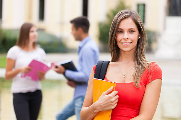 istock Outdoor portrait of a smiling student 526786073