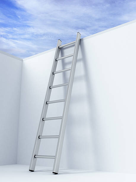 istock Ladder on wall in front of sky 526787807
