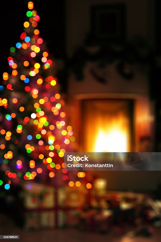 art Christmas scene with tree gifts and fire in background Backgrounds Stock Photo