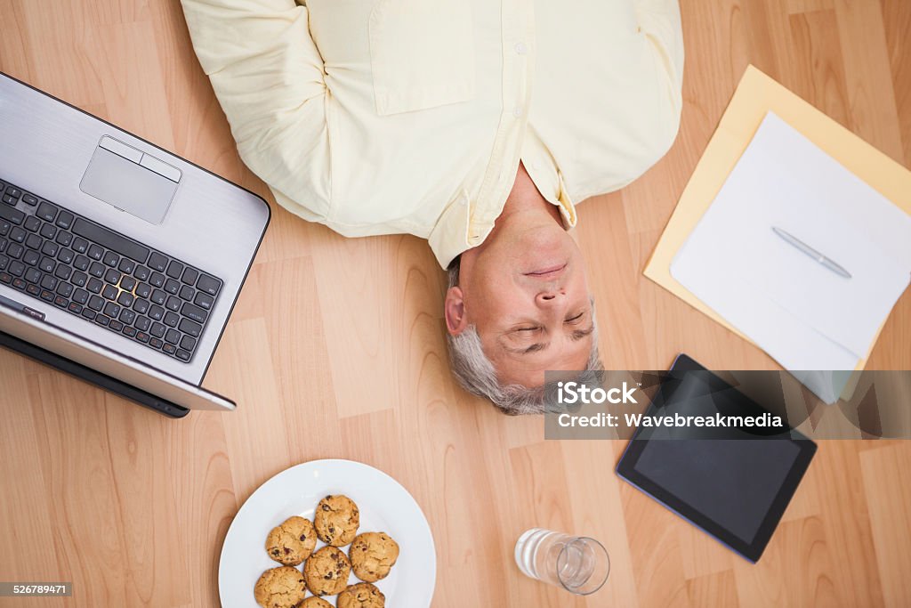 Lying Objects Man Lying On Floor Surrounded By Various Objects Stock Photo - Download ...