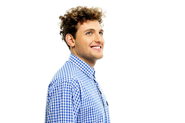 istock man with curly hair looking up 526789507