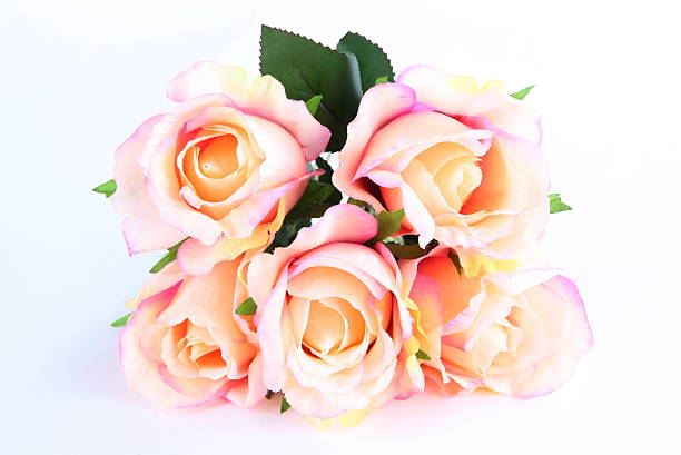 istock Bouquet of artificial orange roses on white background 526789793
