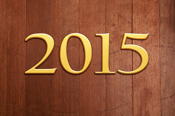 istock Year 2015 Golden Text - Wooden Texture 526806133