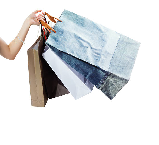 istock Hand with shopping bags on white background isolated 526806173