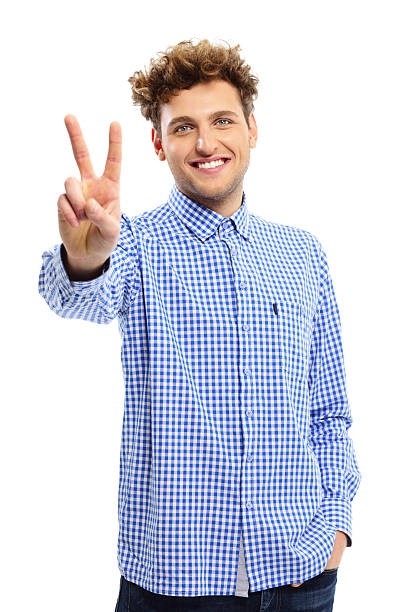 istock man showing victory fingers sign 526806339