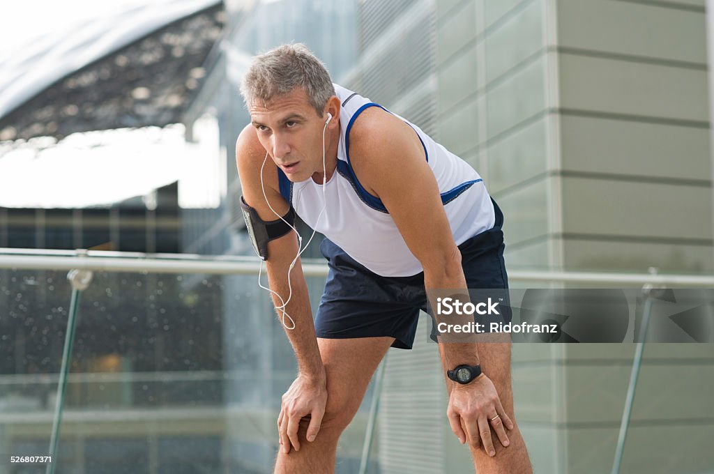 Jogger Resting After Running Portrait Of Exhausted Male Jogger Resting In A Urban Place Tired Stock Photo